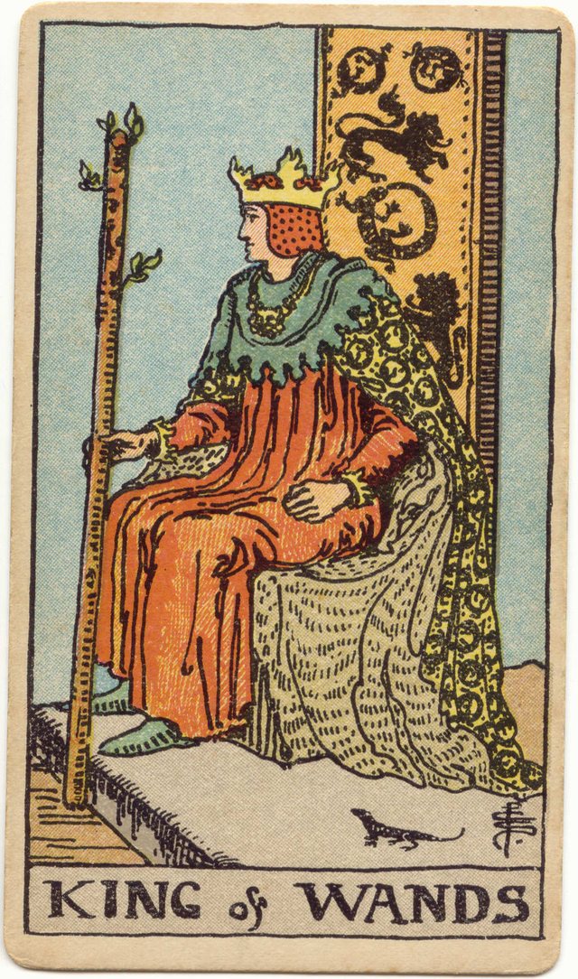 King of Wands: The live salamander, the throne back, the crown and red cap, the leafy wand. Rider–Waite–Smith tarot, 1909.