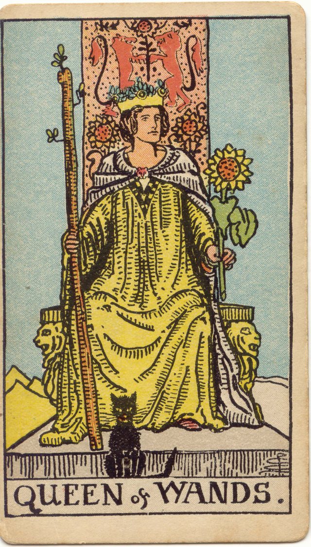 Queen of Wands: The black cat, the sunflower, the lion throne, the leafy wand. Rider–Waite–Smith tarot, 1909.