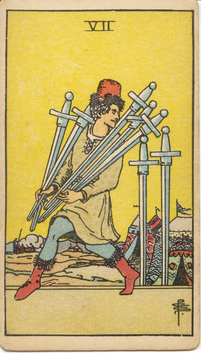 Seven of Swords: The man in the red cap, the five carried swords, the two swords left behind, the camp. Rider–Waite–Smith tarot, 1909.