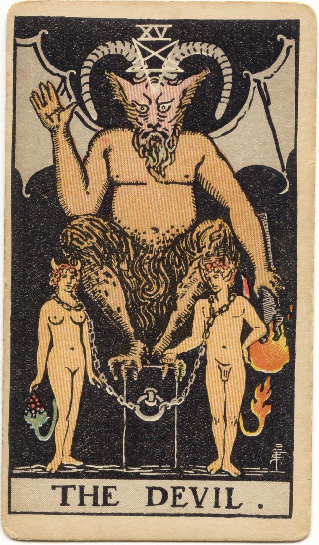 The Devil: The horned figure, the inverted pentagram, the raised hand, the downturned torch. Rider–Waite–Smith tarot, 1909.
